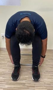 seated trunk flexion to avoid back pain on a flight